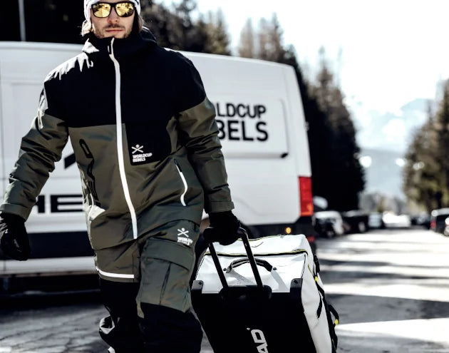 Power Ski - Mann zieht Head-Skischuhtasche hinter sich her
